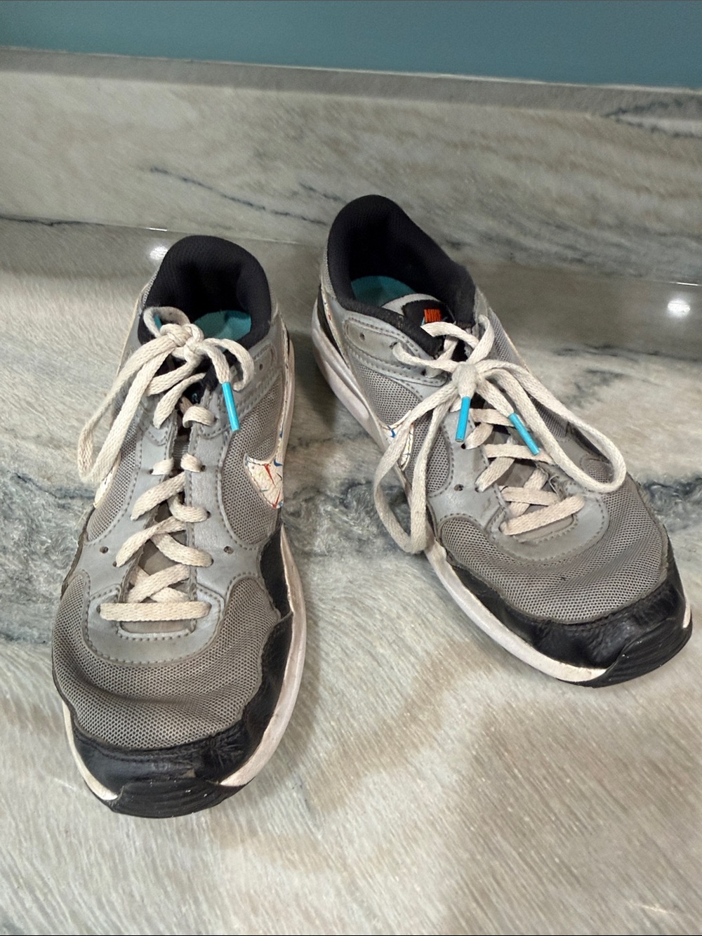 Nike Kids Gray and Black Athletic Sneakers with Teal Accents